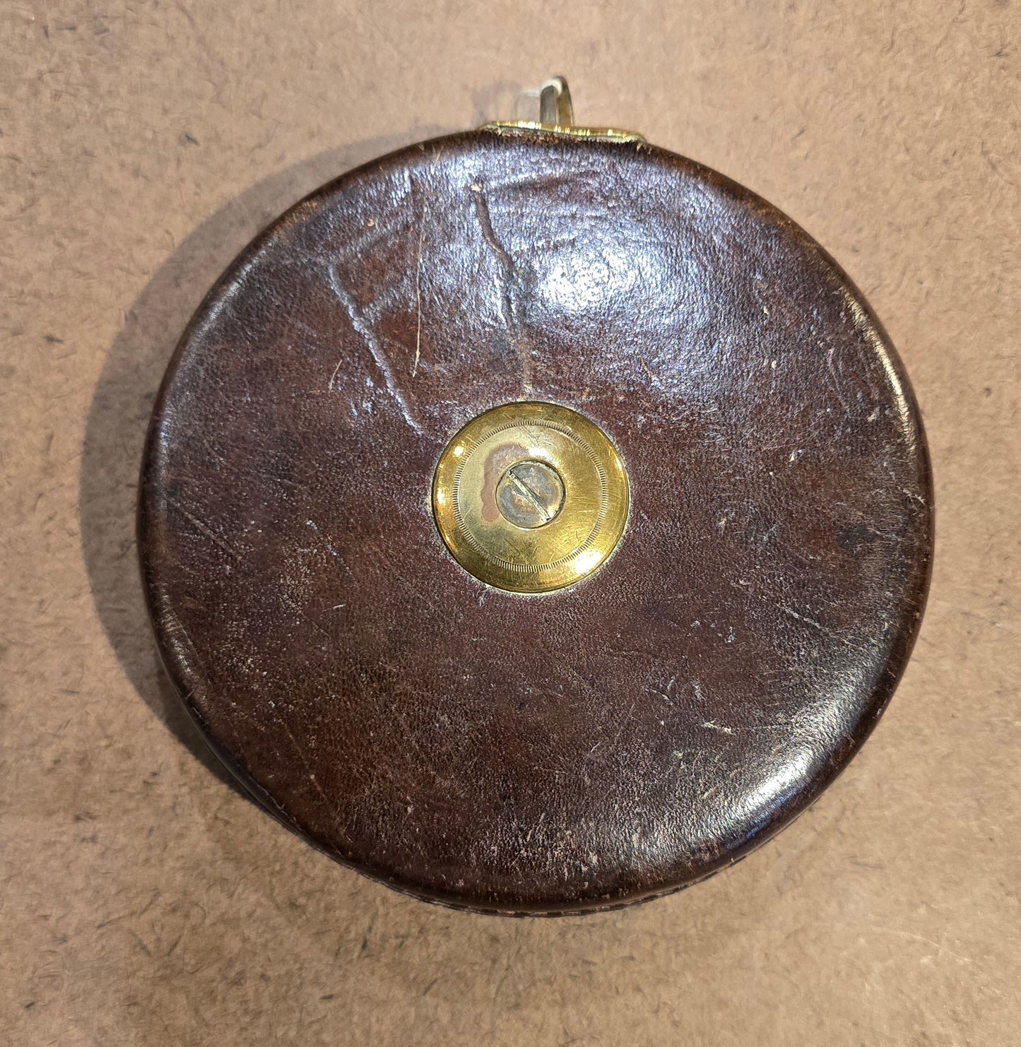 RA 7779 G.W.R. RABONE & SON, BIRMINGHAM 65 FOOT LEATHER CASE TAPE MEASURE.