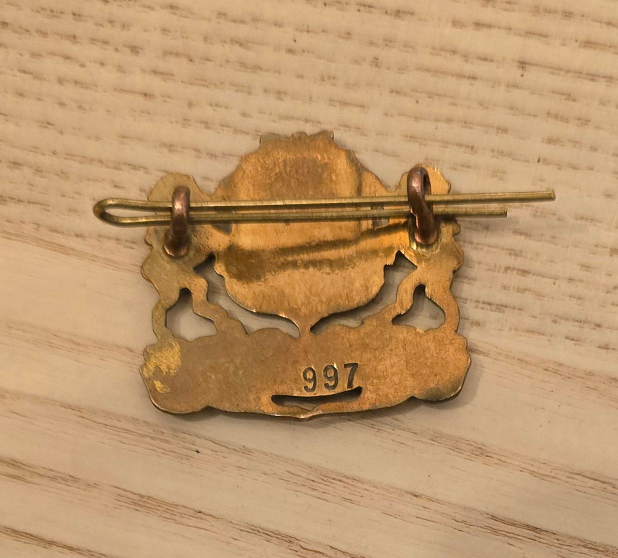 RA 7521  BRASS AND ENAMEL "PULLMAN"  LAPEL BADGE.
