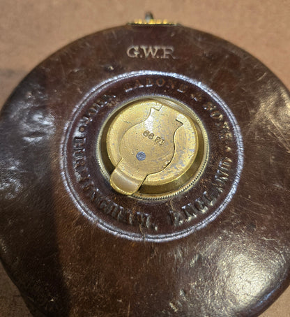RA 7779  G.W.R. RABONE & SON, BIRMINGHAM 65 FOOT LEATHER CASE TAPE MEASURE.