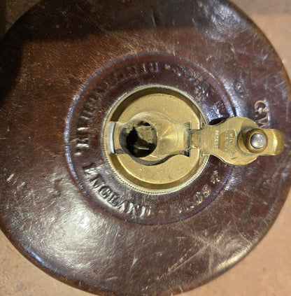 RA 7779  G.W.R. RABONE & SON, BIRMINGHAM 65 FOOT LEATHER CASE TAPE MEASURE.