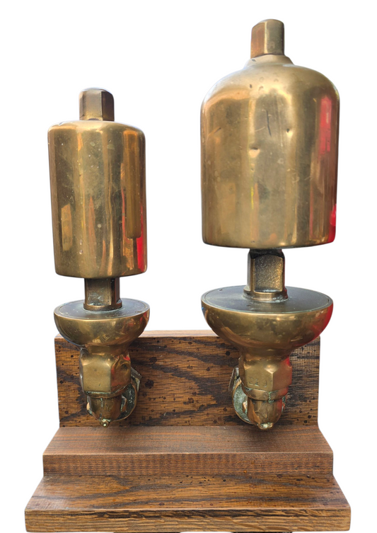 RA 8271  A PAIR OF G.W.R. BRASS LOCOMOTIVE WHISTLES WITH FITTINGS AND BASE.